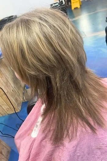 Layered Blonde Wolf Cut with Wispy Ends