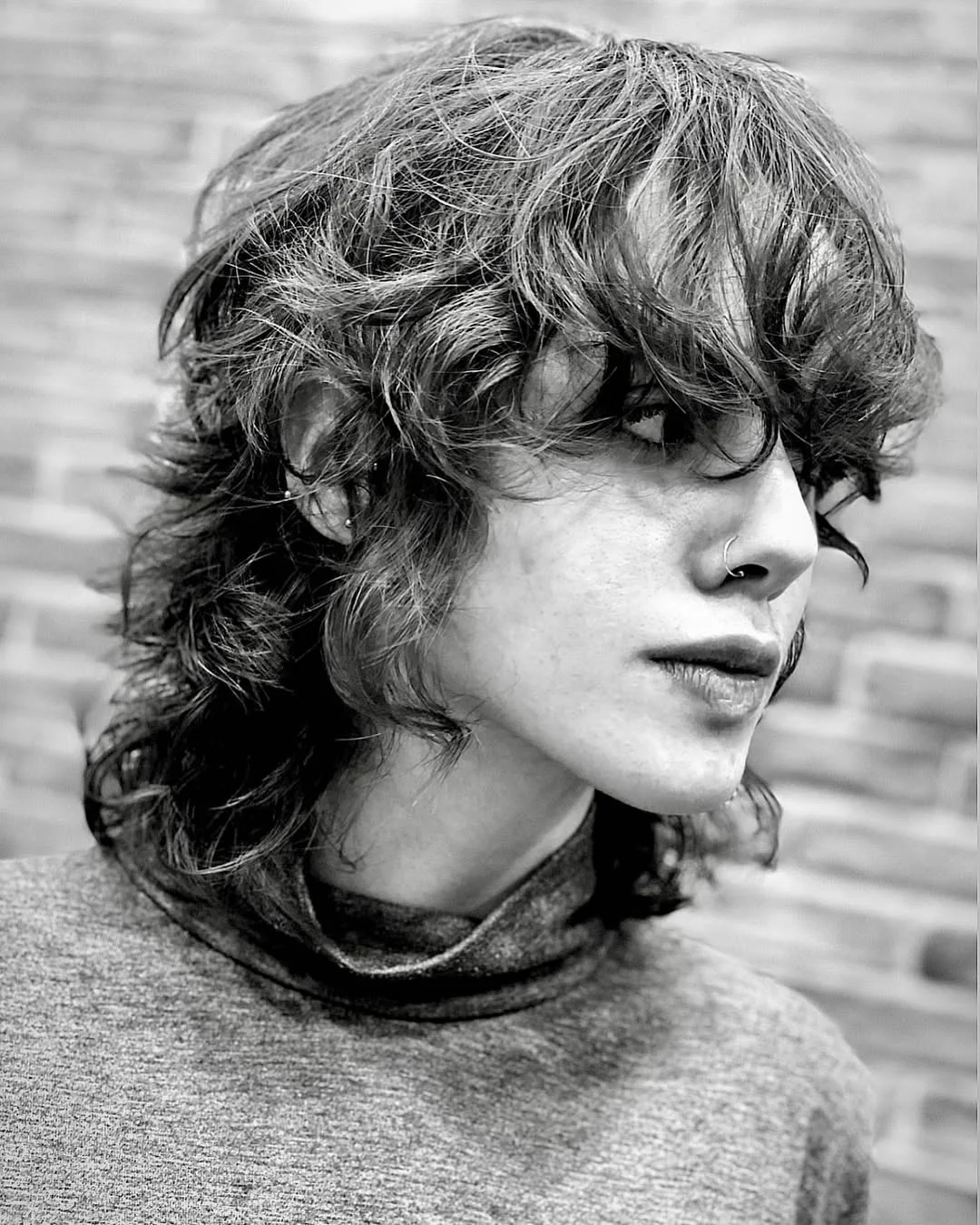 Messy Curly Wolf Cut with Face-Framing Bangs