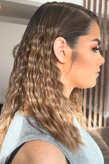 Sleek Wet-Look Waves with Deep Side Part