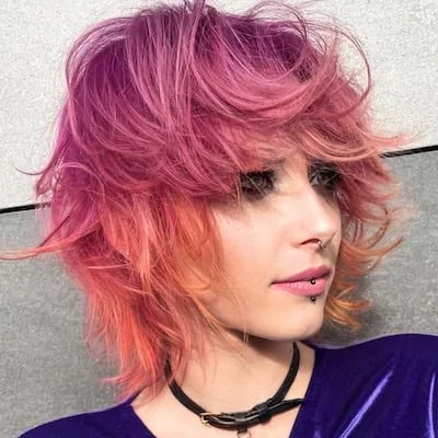 Vivid Pink-to-Orange Wolf Cut with Choppy Texture