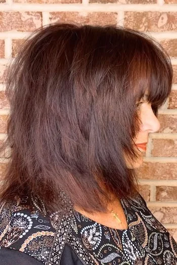 Voluminous Chestnut Shag with Full Bangs
