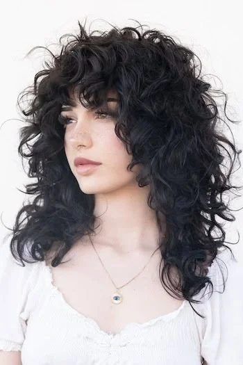 Voluminous Curly Wolf Cut with Soft Bangs