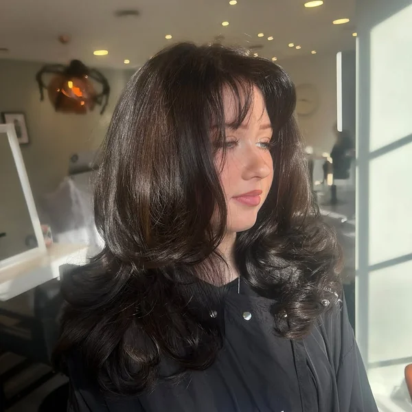 Bouncy Dark Brunette Layers with Curtain Bangs