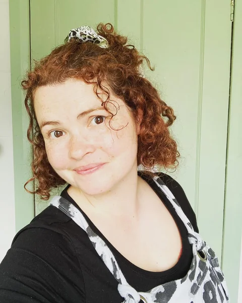 Casual Reddish-Brown Curly Bob with Half-Up Twist