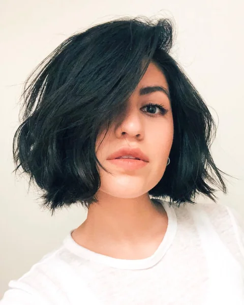 Choppy Dark Bob with Dramatic Side-Swept Volume