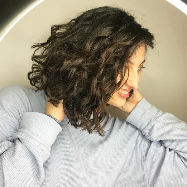 Dark Brunette Curly Bob with Natural Volume