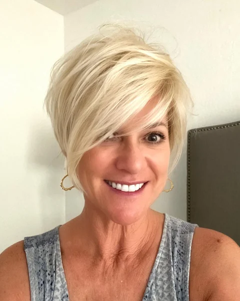 Deep Side-Part Blonde Pixie with Long Bangs