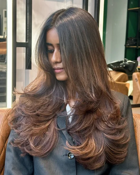 Rich Brunette Butterfly Cut with Voluminous Feathered Layers