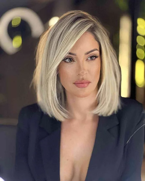 Sleek Blonde Lob with Deep Side Part Volume