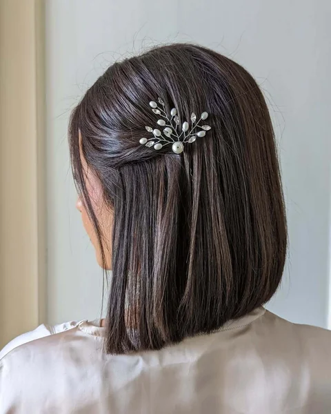 Sleek Brunette Blunt Bob with Pearl Clip