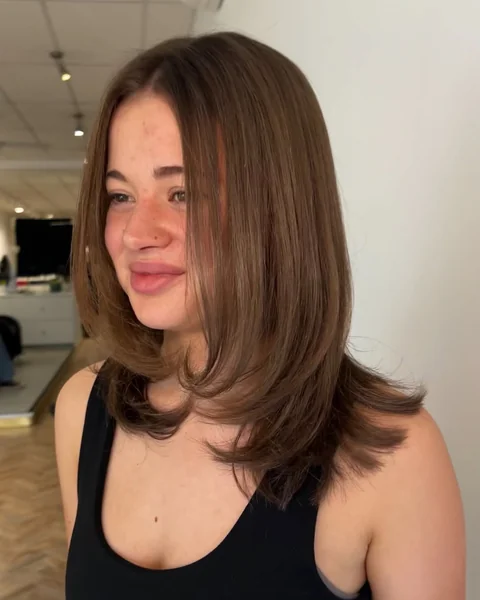 Sleek Straight Shoulder Length Blowout Layers