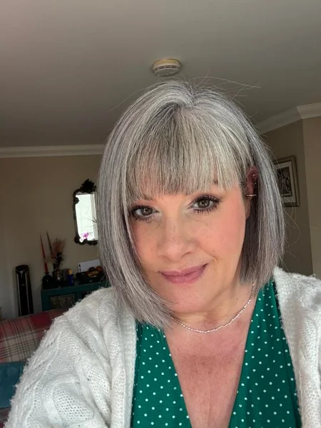 Smooth Silver A-Line Bob with Full Blunt Fringe