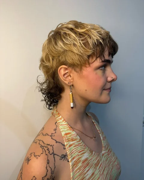 Tousled Blonde Shag with Dark Undercut Layers