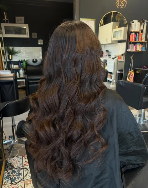 Voluminous Brunette Butterfly Cut for Flowing Length