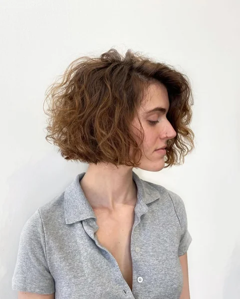 Voluminous Curly Bob with Auburn Highlights