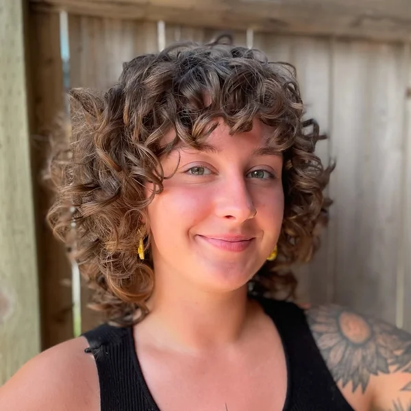 Voluminous Natural Curl Shag with Coil Bangs