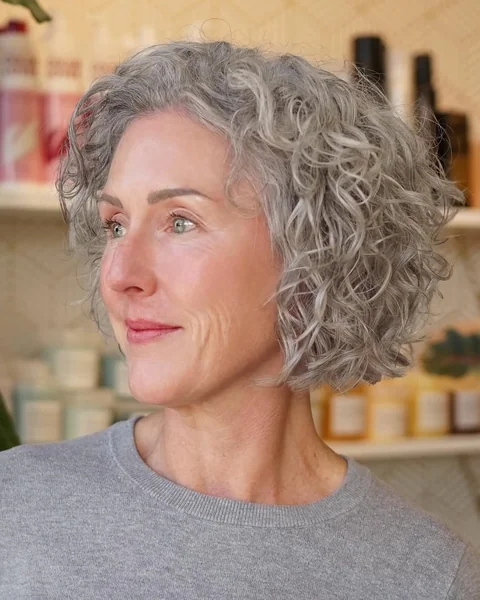 Voluminous Shoulder-Length Silver Bob with Defined Curls