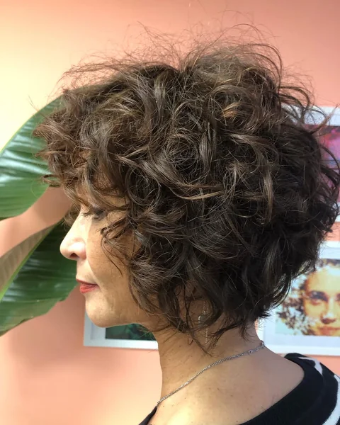 Voluminous Stacked Curly Bob with Wispy Bangs