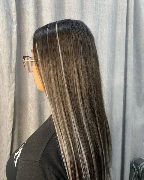 Dark Straight Hair with Bold Silver Stripe Highlights
