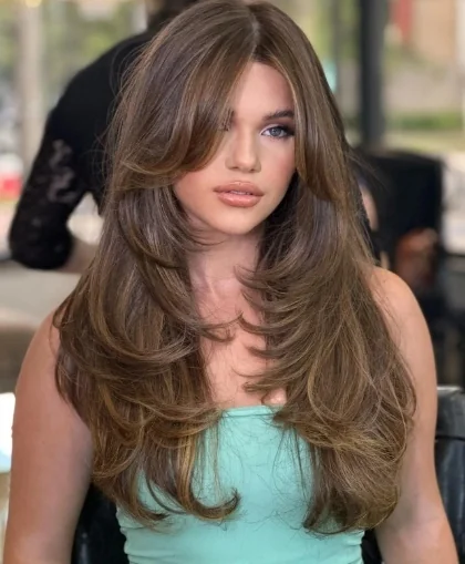 Dimensional Brunette Butterfly Cut with Long, Sweeping Layers