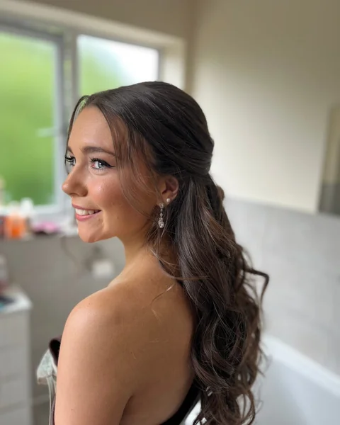 Elegant Side-Swept Half-Up with Polished Waves
