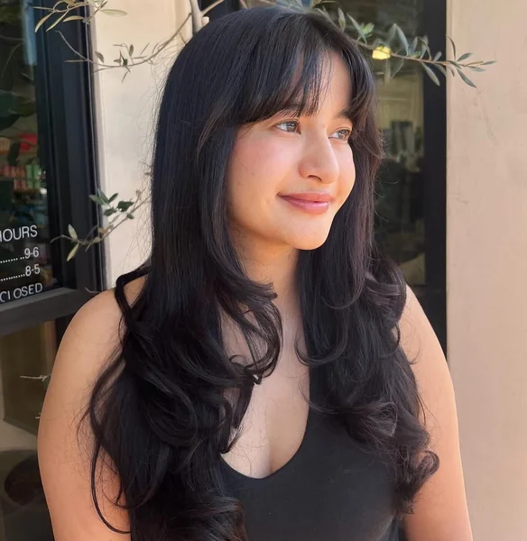 Long Dark Wavy Butterfly Layers with Soft Bangs