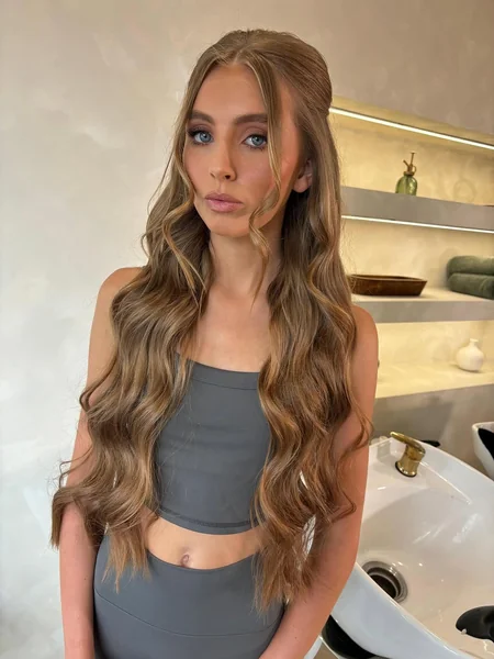 Long Wavy Half-Up Hairstyle with Face-Framing Volume