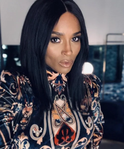 Polished Shoulder-Length Black Bob with Center Part