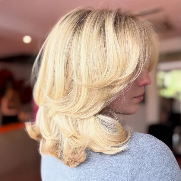 Sunny Blonde Voluminous Lob with Flipped Ends