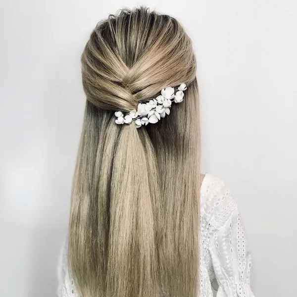 Voluminous Half-Up Blonde Twist with Floral Clip