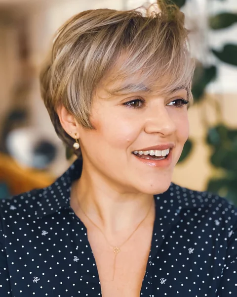 Volumized Blonde Pixie with Long Sweeping Bangs