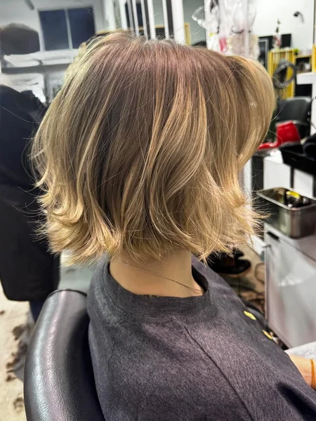 Airy Honey Blonde Bob with Flicked Ends