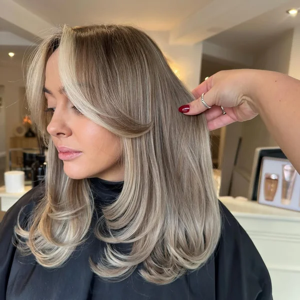 Ash Blonde Butterfly Layers with Sweeping Curtain Bangs