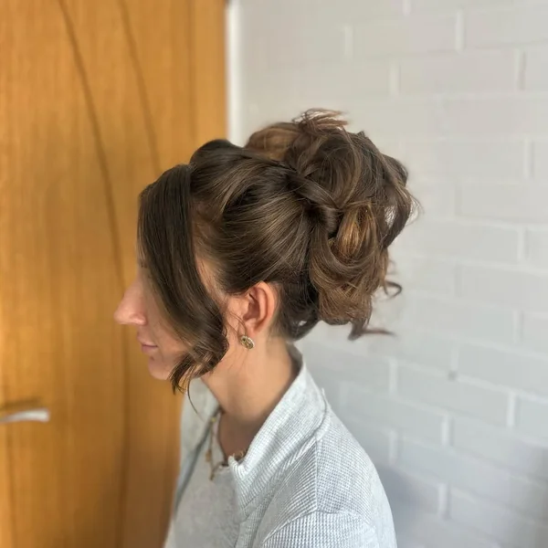 Bohemian Curly High Bun Updo with Delicate Flowers