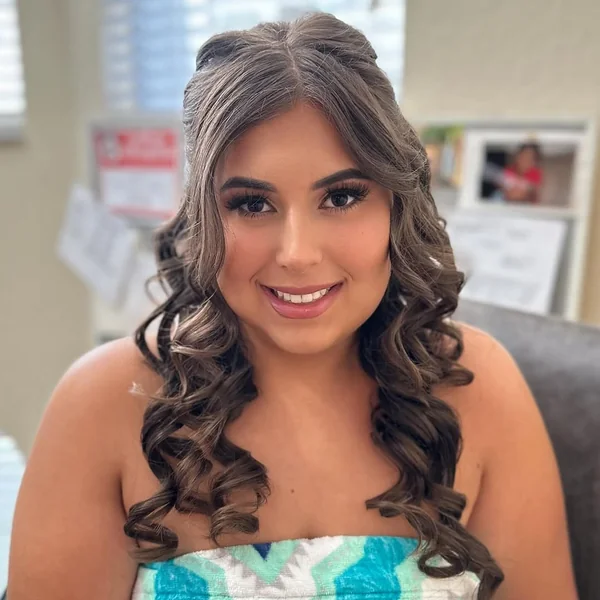 Bouncy Half-Up Style with Face-Framing Spiral Curls