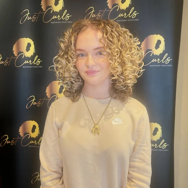 Bright Blonde Layered Curl Cut for Ultimate Volume