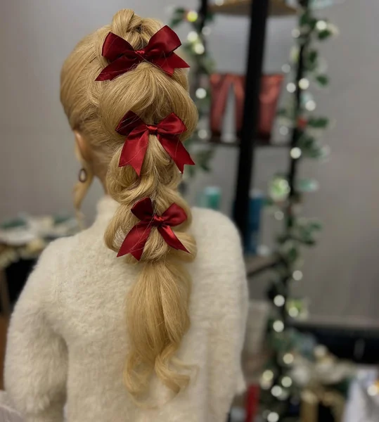 Bubbly Pigtail Hairstyle Adorned with Trio of Red Bows