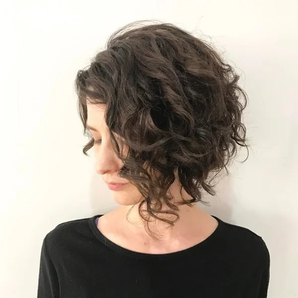 Dark Asymmetrical Curly Bob with Deep Side Part