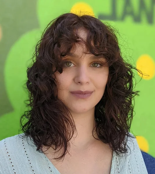 Dark Wavy Shag Cut with Textured Curly Bangs