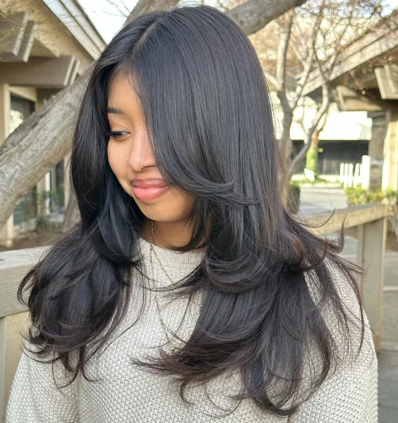 Deep Black Butterfly Cut with Full Face-Framing Layers