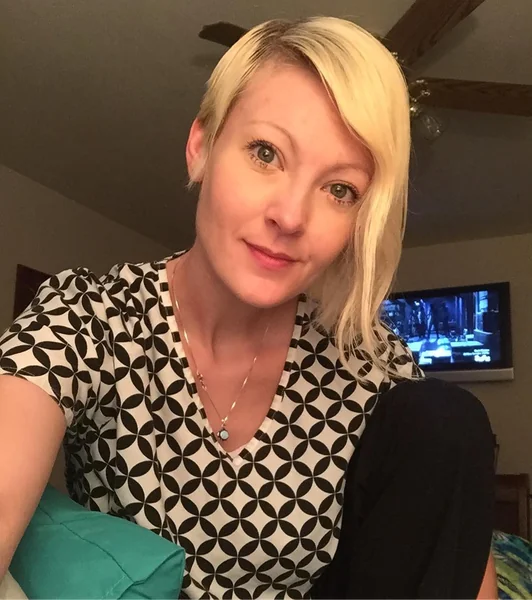 Dramatic Asymmetric Blonde Pixie with Long Side Fringe