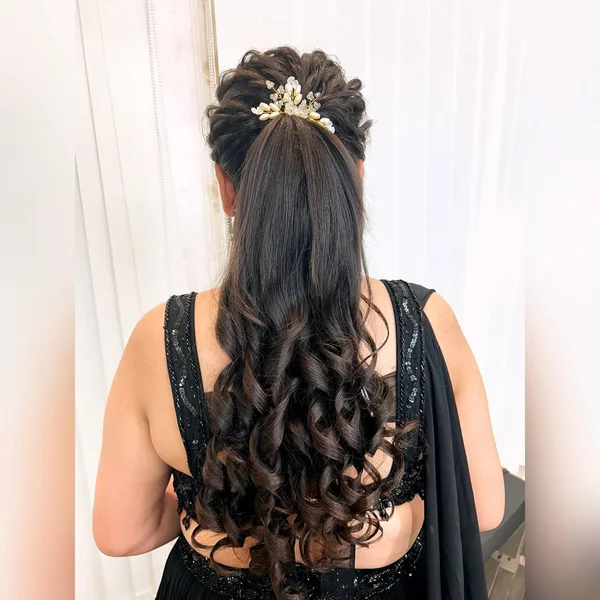 Dramatic Curly High Ponytail with Statement Accessory