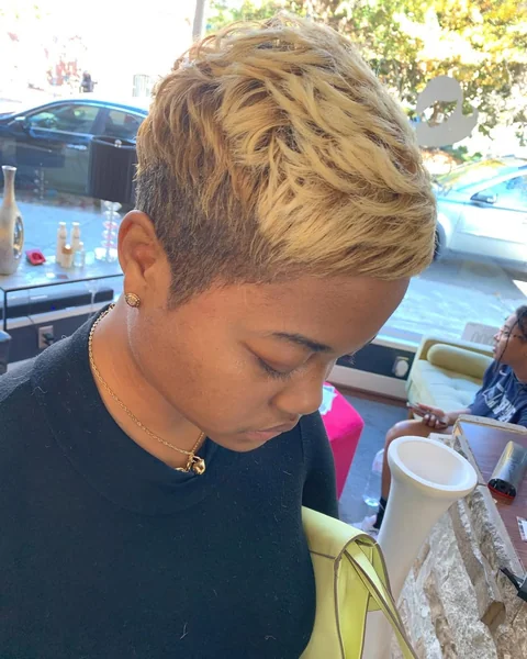 Edgy Blonde Pixie Cut with Tapered Sides