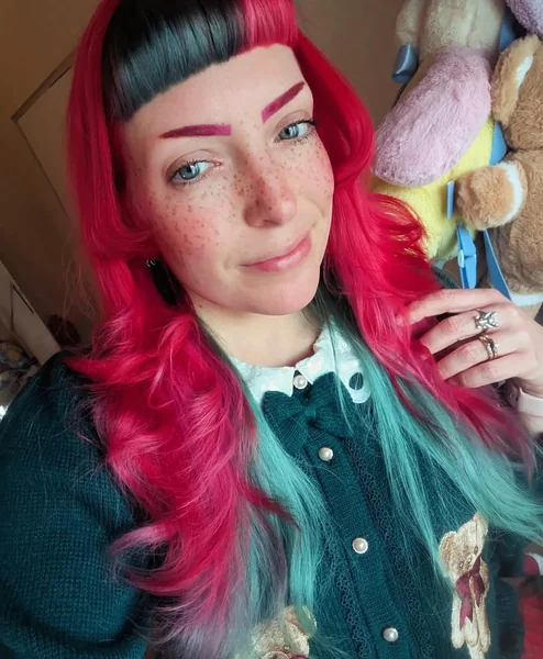 Edgy Magenta and Mint Split Dye Holiday Hair