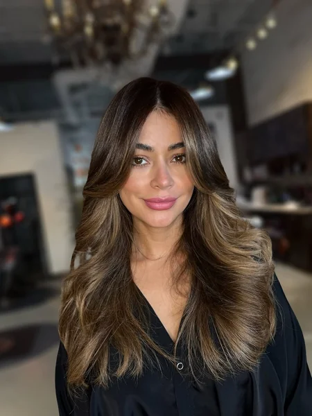Effortless Long Layers with Sun-Kissed Face-Framing Balayage