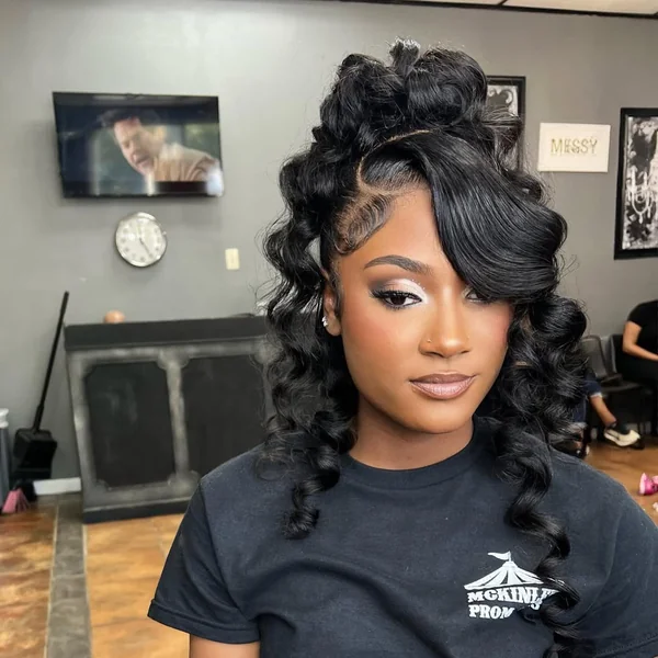 Elegant Half-Up Black Curls with Voluminous Side Sweep
