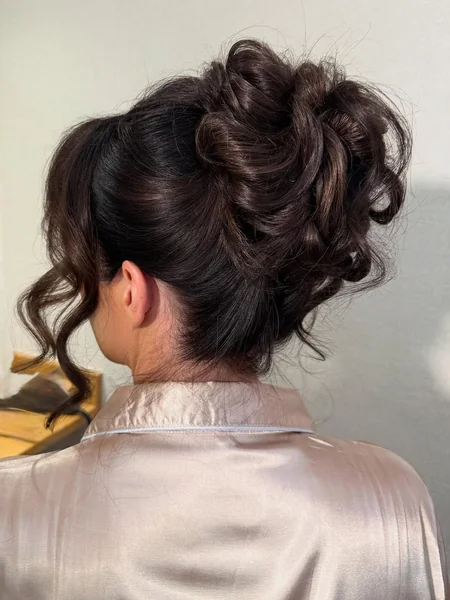 Elegant Low Twisted Brunette Bun Formal Updo