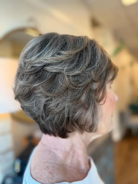 Feathered Salt-and-Pepper Bob with Dynamic Layers