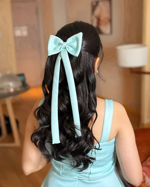 Glossy Waves Half-Up with Elegant Statement Bow