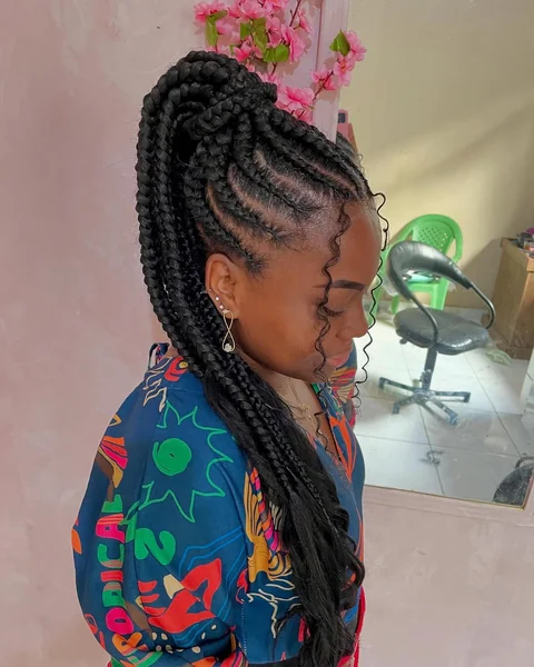 High Braided Ponytail with Flowing Curly Ends
